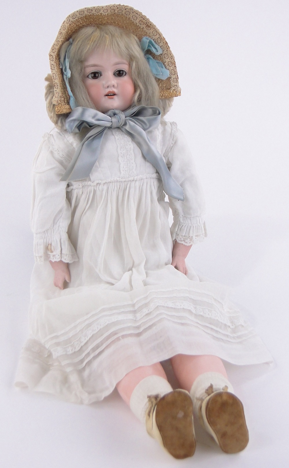 A 19th century Armand Marseille porcelain headed girl doll, with closing eyes and open mouth,