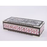An ornate Turkish mother of pearl ivory and hardwood marquetry inlaid jewel box, length 27cm.