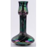 An Art Nouveau Loetz iridescent glass narrow necked vase, with trailed naturalistic design,