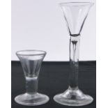 A tall trumpet shaped glass, with domed foot,