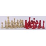 A 19th century red and white stained ivory chess set, King height 8cm, complete.