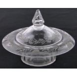 A 19th century hand blown glass bon bon dish and cover, with engraved floral designs, diameter 18cm.