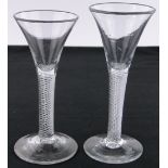 2 18th century glasses with air twist stems, both circa 1745, largest height 16cm.