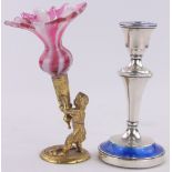 A silver and blue enamelled candlestick,