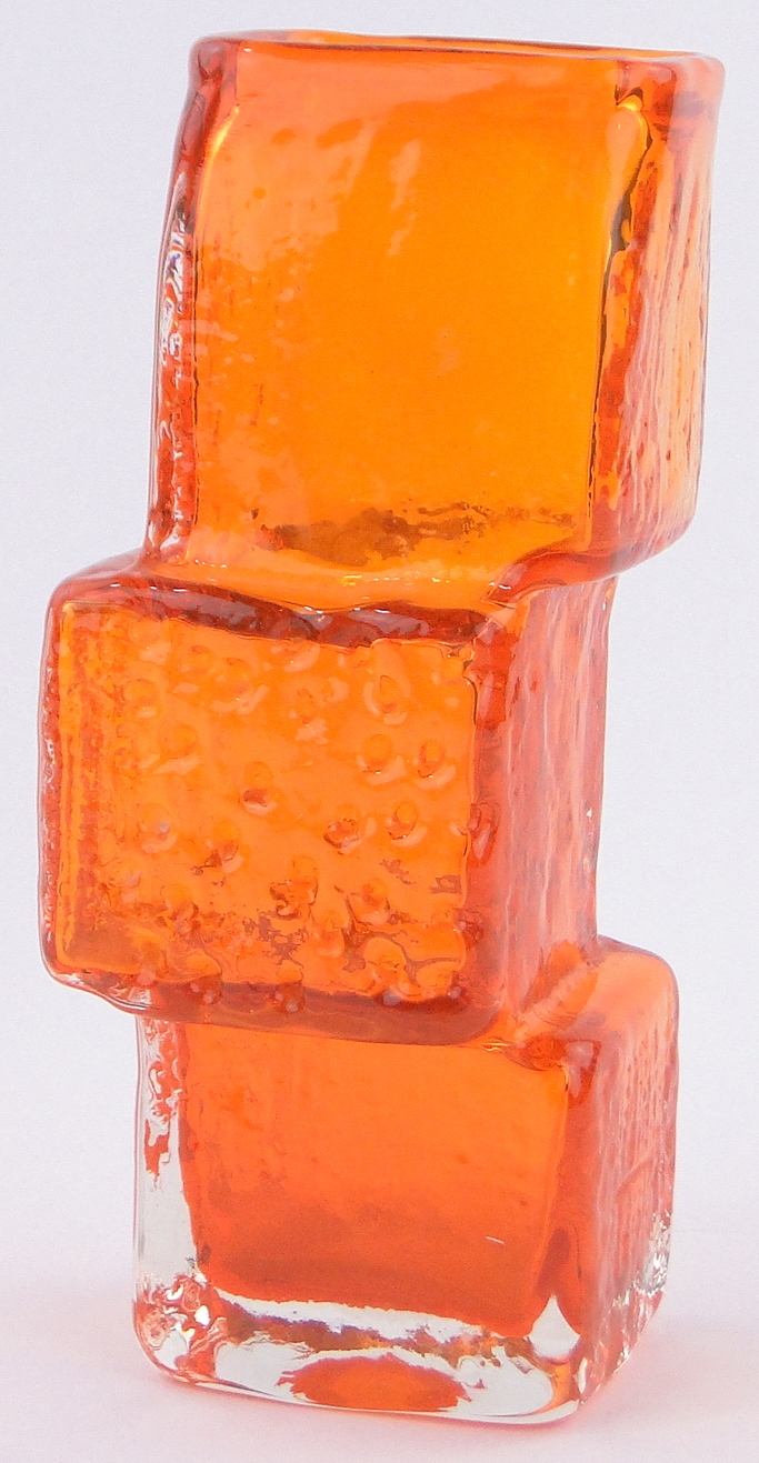 A Whitefriars glass drunken bricklayer vase, designed by Geoffrey Baxter, tangerine orange colour,