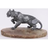 A spelter tiger on onyx plinth, early 20th century, base length 28cm.