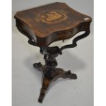 An ornate 19th century rosewood and marquetry inlaid sewing table,