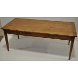 A 19th century French cherrywood farmhouse table, plank top with 2 frieze drawers and tapered legs,