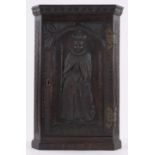 A small Victorian carved oak corner cupboard,