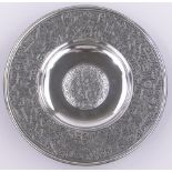 A 19th century electroplate dish, with relief cast geometric design border and central boss,