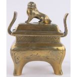 A Chinese cast bronze censer and cover, surmounted by dog of fo, height 17cm.