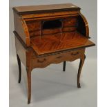 A French Kingwood cylinder front bureau, inlaid floral marquetry decorated front,