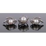 A large 14ct white gold pearl and diamond set cocktail ring and a pair of matching ear clips,