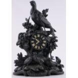 A 19th century Black Forest carved and stained wood cased mantel clock,