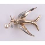 Unmarked gold diamond and pearl set swallow brooch, with ruby eyes, tests as high carat gold,