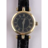 A lady's Gucci 2040L quartz wristwatch, gold plated case with black dial, case width 22mm.