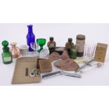 A collection of medical items, mainly Victorian, including poison bottles, smelling salt jar,