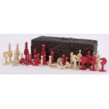 A 19th century red and white stained ivory chess set, King height 8cm.