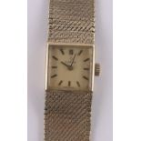 A lady's 9ct gold Omega cocktail wristwatch, gold woven strap, case width 15mm, gross weight 30g,