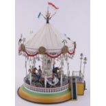 A modern Marklin tinplate carousel, hand driven with musical mechanism, serial no.