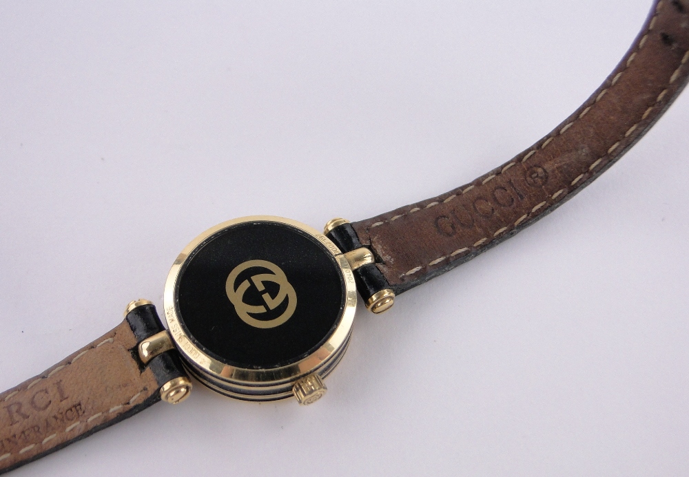 A lady's Gucci 2040L quartz wristwatch, gold plated case with black dial, case width 22mm. - Image 4 of 5