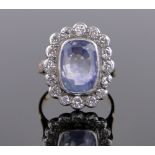 A pale blue sapphire and diamond cluster ring, sapphire 12mm x 8mm, setting height 20mm,