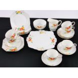 A Paragon china 21-piece teaset, circa 1930, hand painted floral decoration.