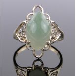 A Chinese 14ct gold jade set ring, setting height 22mm, size T.