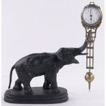 An elephant design mystery clock, painted brass case with enamelled dial, overall height 28cm.