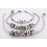 A Pandora silver charm bracelet, 2 other similar with silver charms.