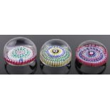 2 Whitefriars millefiore glass paperweights, 1 dated 1976, the others undated, diameter 7.5cm, (3).