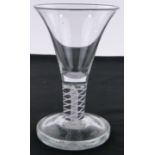 An Antique trumpet shaped wine glass, with milk twist stem and heavy firing foot, height 15cm,