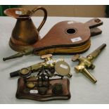 A bellows, beer taps, postage scale and a copper jug.