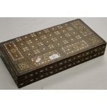 An Eastern inlaid games box with mother of pearl decoration.