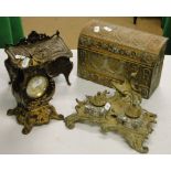 Cast brass jewellery casket, desk stand with inkwells, a clock and a embossed brass letter rack.