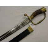 A 19th century English hunting sword with horn handle, leather scabbard and brass mounts.