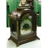 A burr walnut cased 3-train mantel clock with brass dial and moonphase.