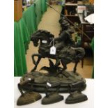 A spelter hunter on horseback on oval plinth and 3 flat irons.