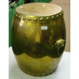 A large Oriental brass barrel and cover with kylin handles.