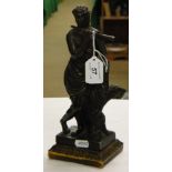 A bronze figure of a classical flute player on gilt metal base.