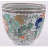 A Chinese porcelain jardiniere, painted enamel birds and foliage, height 32cm, diameter 38cm.