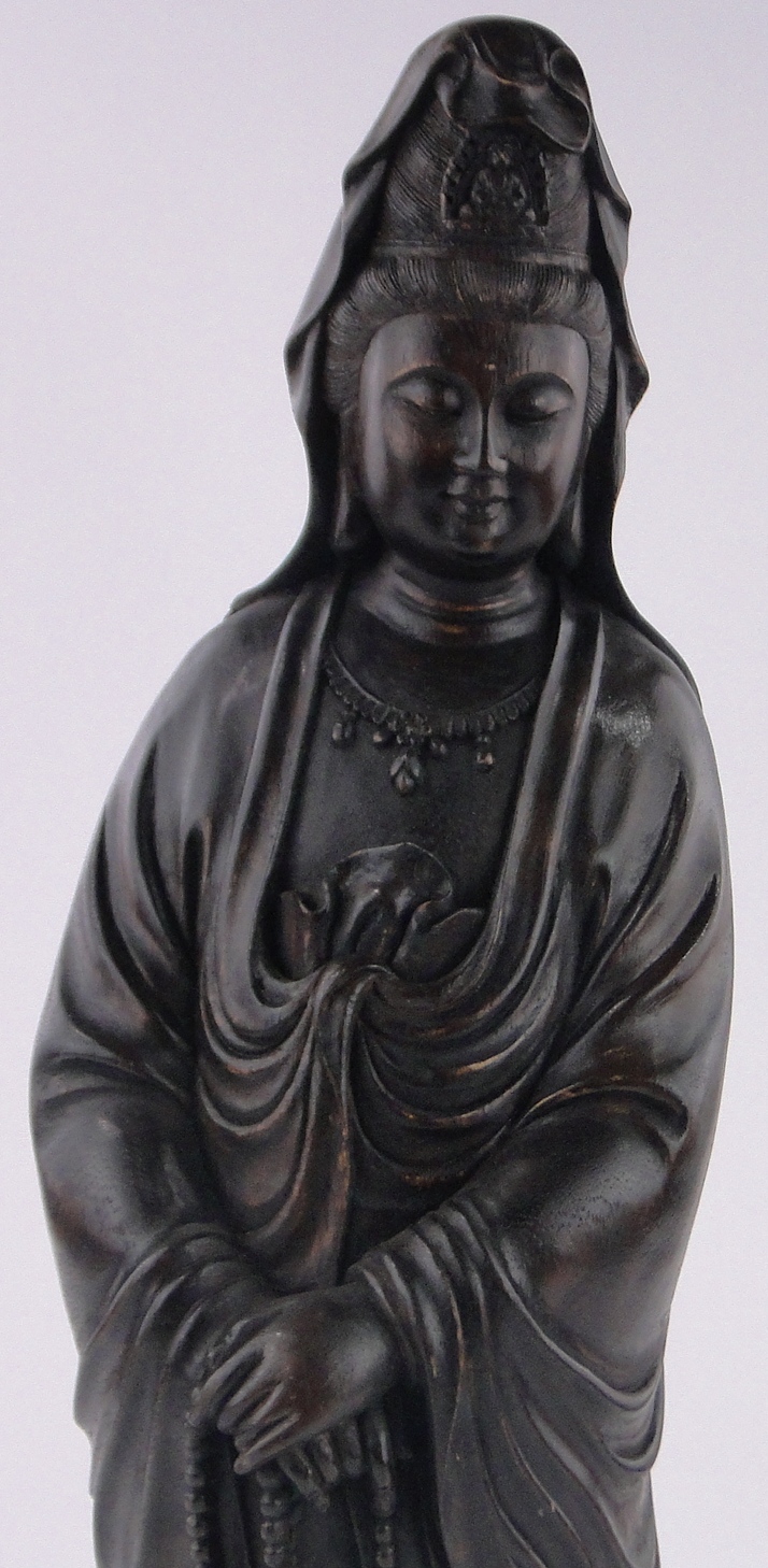 A Chinese carved and stained wood figure of Guanyin, height 60cm. - Image 3 of 3