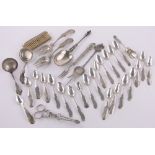 A quantity of mainly 19th century continental silver spoons, sugar tongs, etc., 13.75 oz total.