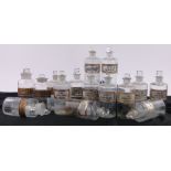 A quantity of Victorian glass chemist's jars with gilded labels, (15).