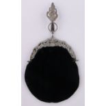 An ornate Victorian evening bag with plated mounts.