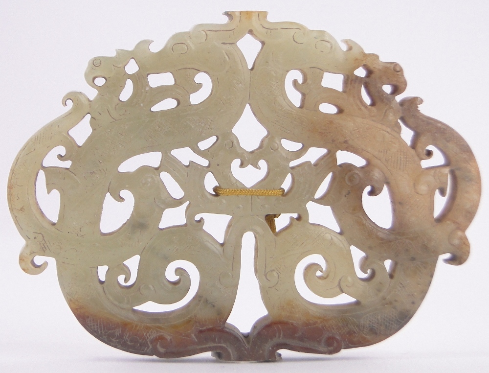 A Chinese relief carved and pierced jade plaque, entwined dragon design, width 8.5cm, height 6.