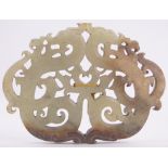 A Chinese relief carved and pierced jade plaque, entwined dragon design, width 8.5cm, height 6.