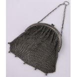 A silver mesh evening bag.