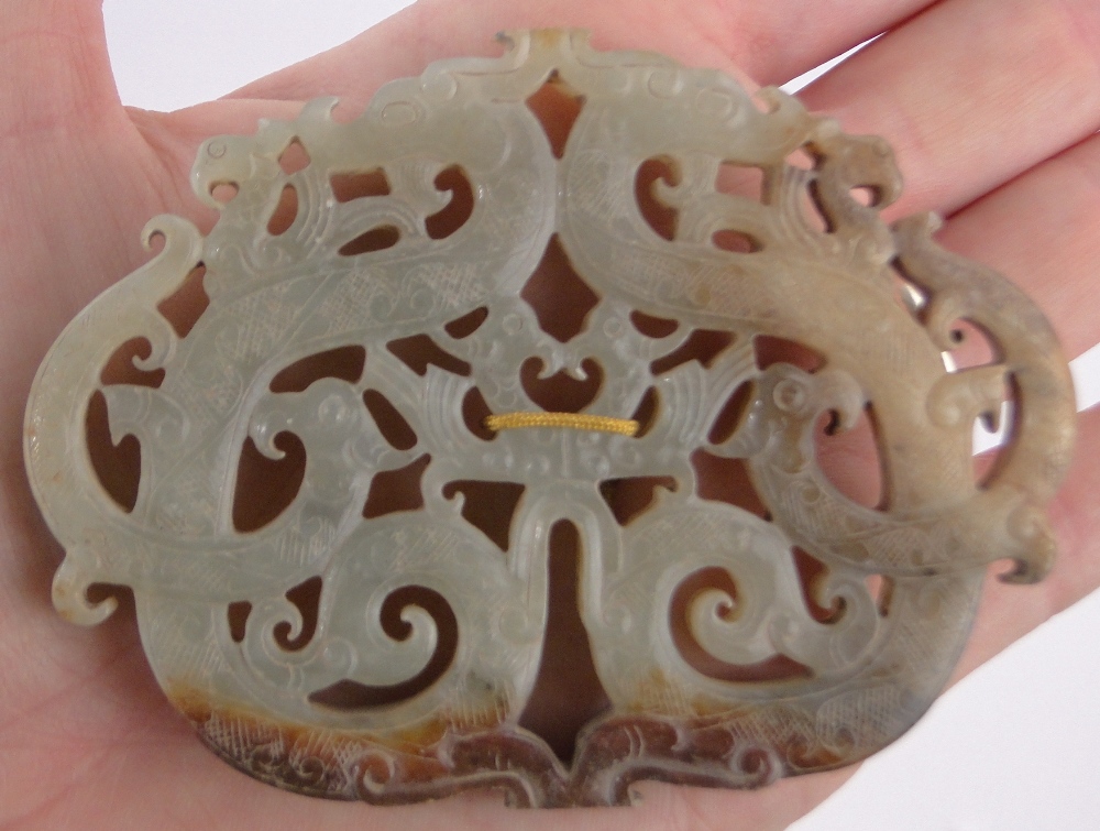 A Chinese relief carved and pierced jade plaque, entwined dragon design, width 8.5cm, height 6. - Image 2 of 6