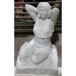 A carved white marble sculpture - seated woman, signed with monogram on base, height 49cm.